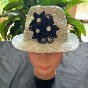 Elegant Silver Sequin Hat with Black Floral Accent